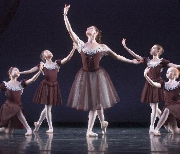 	Nino Gogua in Mozartiana, surrounded by  young dancers from the School of American Ballet who were  contracted for the Pillow exclusive